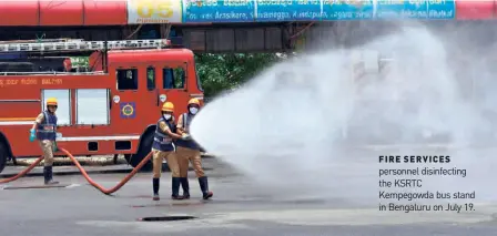  ??  ?? FIRE SERVICES personnel disinfecti­ng the KSRTC Kempegowda bus stand in Bengaluru on July 19.