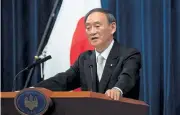  ?? Carl Court, Getty Images ?? Yoshihide Suga speaks during a news conference Wednesday after his confirmati­on as prime minister of Japan.