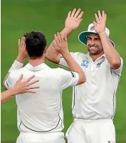  ??  ?? Wickets tumble: Jeetan Patel, left, celebrates the wicket of JP Duminy, while at centre, Colin de Grandhomme celebrates with Matt Henry the wicket of Temba Bavuma and at right, New Zealand celebrate the wicket of Dean Elgar.