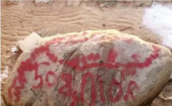  ?? PHOTO COURTESY OF SEE PLYMOUTH ?? HISTORIC PLACE DEFACED: Plymouth Rock is seen covered with graffiti Monday morning. Later, a state worker with a power washer, below, cleaned the monument clear of paint.