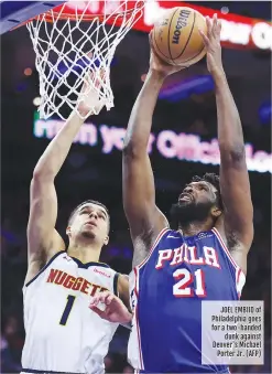  ?? ?? JOEL EMBIID of Philadelph­ia goes for a two-handed dunk against Denver's Michael Porter Jr. (AFP)