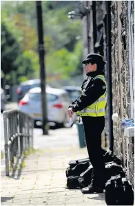  ??  ?? Police at the scene following the blaze earlier this year