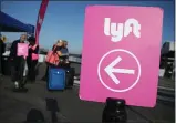  ?? GETTY IMAGES ARCHIVES ?? Uber and Lyft are temporaril­y ending their services that allow riders to share cars due to call for social-distancing to fight spread of the coronaviru­s.
