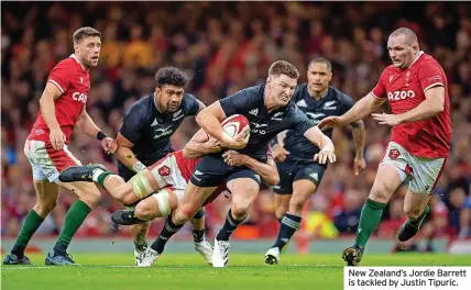  ?? ?? New Zealand’s Jordie Barrett is tackled by Justin Tipuric.