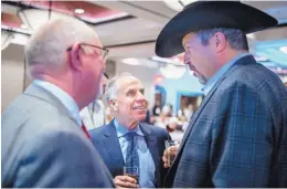  ?? ROBERTO E. ROSALES/JOURNAL ?? ESPN’s Tim Kurkjian, center, talks with Sam Bregman, right, as UNM baseball coach Ray Birmingham looks on Friday at the First Pitch Banquet.