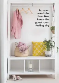  ??  ?? AN OPEN WARDROBE FROM IKEA KEEPS THE GUEST ROOM FEELING AIRY