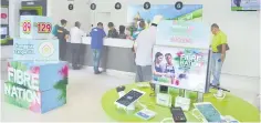  ??  ?? File photo shows customers at the Maxis branch at Jalan Satok.