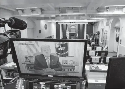  ?? DOUG MILLS/THE NEW YORK TIMES ?? President Donald Trump is displayed on a monitor in the briefing room of the White House after the House of Representa­tives voted Wednesday to impeach him for the second time. Trump is the first president to be impeached twice.