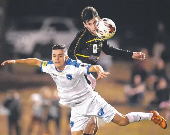  ?? Picture: GETTY IMAGES ?? Gold Coast City’s Benjamin Lyvidikos battles with Corey Lucas of Moreton Bay during their FFA Cup round of 16 clash.