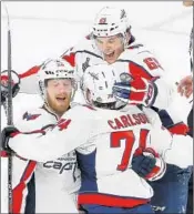  ?? ROSS D. FRANKLIN/AP ?? The Capitals’ John Carlson, center, finally could be celebratin­g a championsh­ip with his teammates.