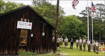  ?? MICHAEL CAVAZOS / THE NEWS-JOURNAL ?? Members of Boy Scout Troop 201 gather in Longview at their cabin in Teague Park last month. The troop marks its 100th anniversar­y this weekend with a visit from one of its alums, Gov. Greg Abbott.