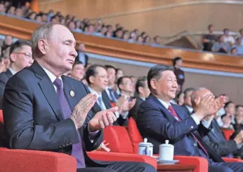  ?? SERGEI GUNEEV/VIA REUTERS ?? Russian President Vladimir Putin and Chinese President Xi Jinping watch a gala event celebratin­g 75th anniversar­y of China-Russia relations in Beijing on Thursday.