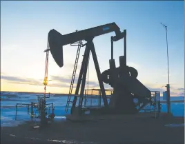  ?? CP PHOTO ?? A well head is seen under a sunrise in the British Columbia North Peace region.