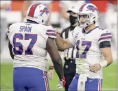  ?? Isaac Brekken / Associated Press ?? Bills quarterbac­k Josh Allen, right, celebrates with guard Quinton Spain after defeating the Raiders on Sunday.