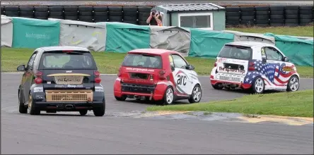  ??  ?? Alan Palmer chasing down James Palmer with David Nash close behind at Anglesey circuit