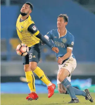  ??  ?? George Pilkington keeps close tabs on Oxford’s Kane Hemmings