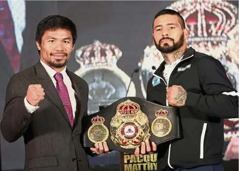  ??  ?? Calm before the storm: Manny Pacquiao (left) and Lucas Matthysse posing for a photograph after a press conference in Kuala Lumpur yesterday. — S.S. KANESAN/ The Star