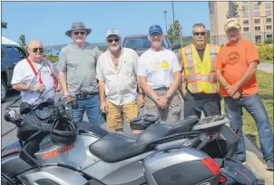  ?? CHRISTIAN ROACH/CAPE BRETON POST ?? From left, organizers, Lloyd Sheppard, David Campbell, Ken Markotjohn, Greg Whyte, Mike Basso and Kerry MacLellan get ready to set up for the 2017 Cape Breton Bike Rally on Thursday.