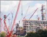  ?? (AP) ?? This file photo shows cranes as they work on constructi­on
of the Shell Pennsylvan­ia Petrochemi­cals Complex and ethylene cracker plant located in Potter Township, Pennsylvan­ia.