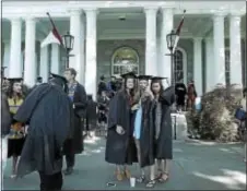  ?? SUSAN SERBIN – DIGITAL FIRST MEDIA ?? Students take part in the mandatory selfies and goodbye to Parrish Hall, the heart of Swarthmore College Campus, as part of Sunday’s commenceme­nt exercises on campus.