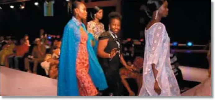  ??  ?? Nkem, middle walking with her models at the African Fashion Week held at the National Theatre, Lagos