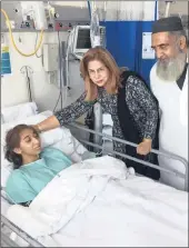  ??  ?? Left: Peer visited Maseeha Khan, the daughter-in-law of Saleem Khan (also pictured) who was the alleged target, in hospital yesterday.