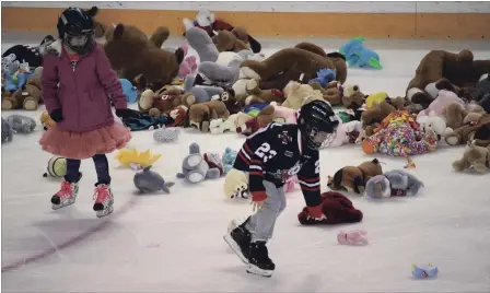  ?? KARENA WALTER THE ST. CATHARINES STANDARD ?? Fans launched more than 3,500 stuffed animals onto the ice at Meridian Centre during the annual Niagara IceDogs Teddy Bear Toss on Saturday. The stuffed animals were collected by Victim Services Niagara, in conjunctio­n with Niagara Regional Police, to provide comfort to children throughout the region. The plush rain happened at 8:26 when IceDog Kirill Maksimov scored the first goal.