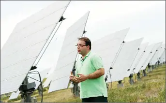  ??  ?? Spanish investor in solar energy David Utiel speaks during an interview in a field of solar panels in Mahora, near eastern
Spanish city of Albacete on May 7. (AFP)