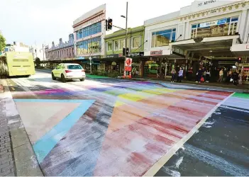  ?? Photo: RNZ ?? The rainbow crossing on Auckland’s Karangahap­e Road was covered in white paint overnight. Rain washed much of the paint away, but remnants could still be seen on the crossing.