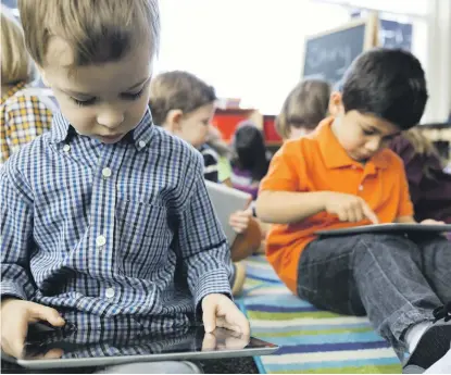  ??  ?? Technology-based learning tools can help engage children’s attention and help maximise their potential