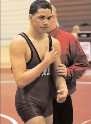  ?? Photo by Ernest A. Brown ?? Julian Jerez didn’t know how to wrestle before he went to Woonsocket High, but in four years he accrued the most wins in school history, recording his 100th win Wednesday night against East Greenwich.