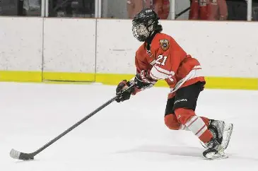  ?? Dave Stewart/Hearst Connecticu­t Media ?? Fairfield Prep’s James Murphy skates with the puck against New Canaan at the Darien Ice House on Dec. 16.