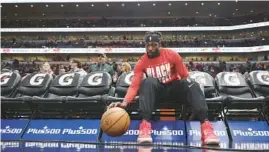  ?? JOHN J. KIM/CHICAGO TRIBUNE ?? Bulls guard Patrick Beverley dribbles a ball while seated before a game against the Nets on Feb. 24 at the United Center.