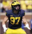  ?? ASSOCIATED PRESS FILE PHOTO ?? Michigan defensive end Aidan Hutchinson is a finalist for the Heisman Trophy along with quarterbac­ks Bryce Young (Alabama), C.J. Stroud (Ohio State) and Kenny Pickett (Pittsburgh). The award will be presented on Dec. 11in New York.