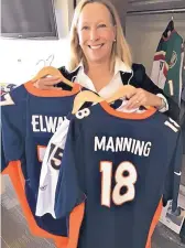  ?? KENT WALZ/JOURNAL ?? PNM CEO Pat Collawn shows her John Elway and Peyton Manning jerseys. The diehard Denver Broncos fan has four team jerseys in her office closet.
