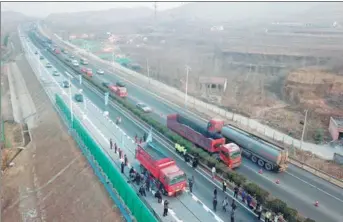  ?? ZHU ZHENG / XINHUA ?? China’s first photovolta­ic road, in Jinan, Shandong province, opened to traffic in December.