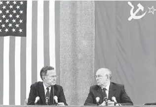  ?? AFP / Getty Images ?? President George H.W. Bush and Soviet counterpar­t Mikhail Gorbachev during a 1991 summit.