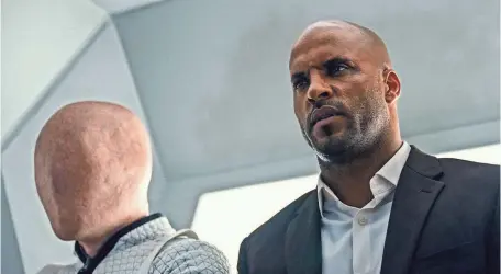  ?? PHOTOS BY STARZ ENTERTAINM­ENT ?? Shadow Moon (Ricky Whittle) is introduced to all manner of weirdness in Starz’s American Gods.