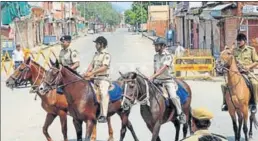  ?? PTI ?? Police personnel patrolling a locality in Jaipur.