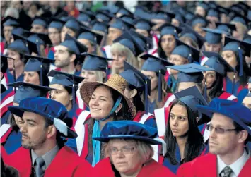  ?? THE CANADIAN PRESS FILES ?? A Simon Fraser University student wears a First Nations Coast Salish woven cedar hat as she and other students wait to receive their degrees during the fall convocatio­n ceremony at the university in Burnaby, B. C., on Oct. 11, 2013. Canadians are...