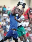  ?? | BACKPAGEPI­X ?? OVIDY KARURU is challenged by Maximilian Mbaeva during yesterday’s match