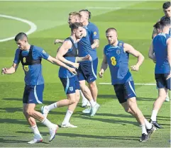  ?? PHOTOS BY AFP ?? England players take part in a training session in Al Wakrah.