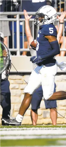  ?? BARRY REEGER/AP ?? Penn State wide receiver Jahan Dotson scores on a 25-yard touchdown pass Saturday in the second quarter against Ball State in State College, Pa.