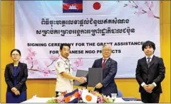  ?? JAPANESE EMBASSY ?? Japanese ambassador Atsushi Ueno (centre right) oversees the signing ceremony for funding for demining operations.