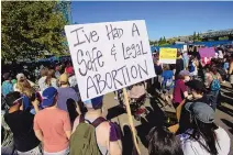  ?? CRAIG MITCHELLDY­ER/ASSOCIATED PRESS ?? Protesters hold signs demonstrat­ing against the Supreme Court’s decision to overturn Roe v. Wade in Portland, Ore. Providers in the rural West are worried about meeting demand and staff shortages.