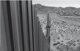  ?? Christian Torres, Associated Press file ?? A truck travels on the Mexico side of the U.S. border fence that separates Anapra, Mexico, and Sunland Park, N.M.