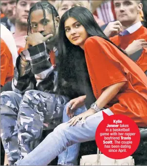  ??  ?? Kylie Jenner takes in a basketball game with her rapper boyfriend Travis Scott. The couple has been dating since April.