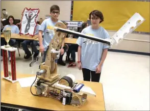  ?? The Sentinel-Record/Richard Rasmussen ?? LIVE DEMONSTRAT­ION: Members of the Lakeside Middle School robotics team Clint Cox, left, and Meagan Abney watch their robot operate during a demonstrat­ion on Thursday. The robotics team recently won first place in the state competitio­n and 12th place in the regional competitio­n against teams from eight other states.