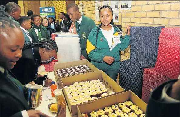  ??  ?? CHAMPIONS: Cathcart High School pupils show off their Dancing Taste Buds Café, which helped them win the internatio­nal competitio­n last week