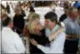  ?? PATRICK SEMANSKY - THE ASSOCIATED PRESS ?? Judy Hiaasen, center left, sister of Rob Hiaasen, one of the journalist­s killed in the shooting at The Capital Gazette newspaper offices, hugs her nephew Scott following a memorial service, Monday, in Owings Mills, Md.